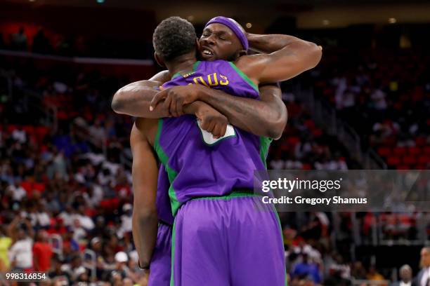 Reggie Evans and Qyntel Woods of the 3 Headed Monsters celebrate after beating Tri-State 50-48 during BIG3 - Week Four at Little Caesars Arena on...