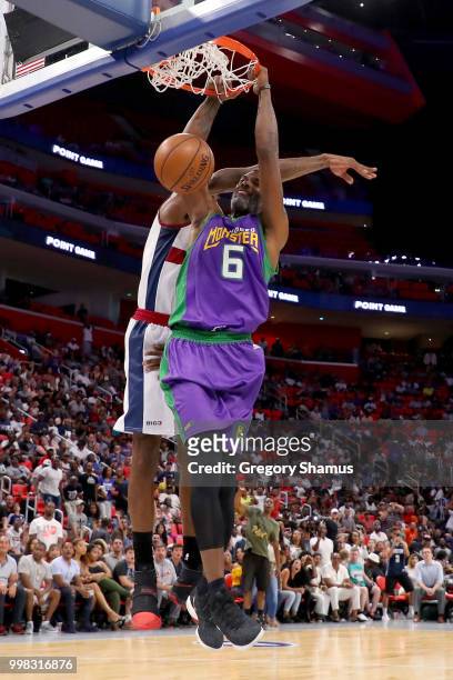 Qyntel Woods of the 3 Headed Monsters dunks the ball past Amar'e Stoudemire of Tri-State during BIG3 - Week Four at Little Caesars Arena on July 13,...