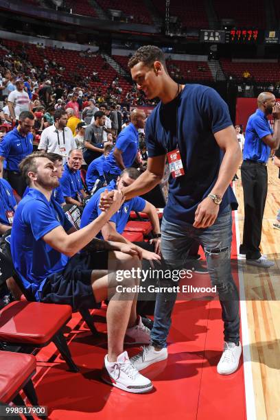 Luka Doncic and Dwight Powell of the Dallas Mavericks talk during the game against the Golden States Warriors during the 2018 Las Vegas Summer League...