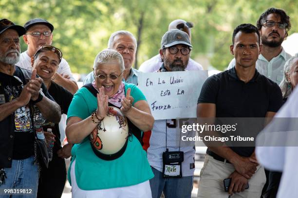 Supporters cheer on assault victim Mia Irizarry as she speaks at Humboldt Park Boat House in Chicago on Friday, July 13, 2018. She was assaulted by...