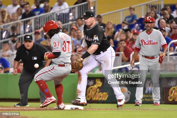 Odubel Herrera of the Philadelphia Phillies gets hit by the baseball while running to first base after striking out in the eighth inning against the...