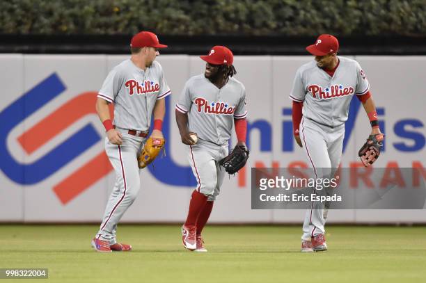 Odubel Herrera of the Philadelphia Phillies celebrates with Rhys Hoskins and Aaron Altherr after defeating the Miami Marlins at Marlins Park on July...
