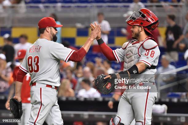 Pat Neshek of the Philadelphia Phillies is congratulated by Jorge Alfaro after defeating the Miami Marlins at Marlins Park on July 13, 2018 in Miami,...