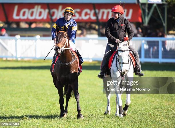 Dwayne Dunn returns to the mounting yard on Brutal after winning the Ladbrokes.com.au Handicap , at Caulfield Racecourse on July 14, 2018 in...