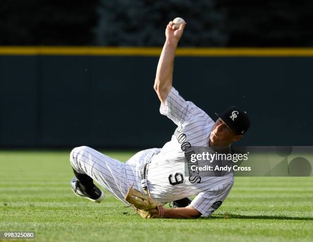 Colorado Rockies second baseman DJ LeMahieu throws to first, but not in time to throw out Seattle Mariners second baseman Dee Gordon in first the...