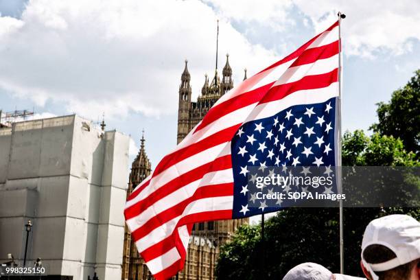 Flag is seen flown upside down in front of the UK parliament during protests by anti-Trump supporters against Donald Trumps visit to the United...