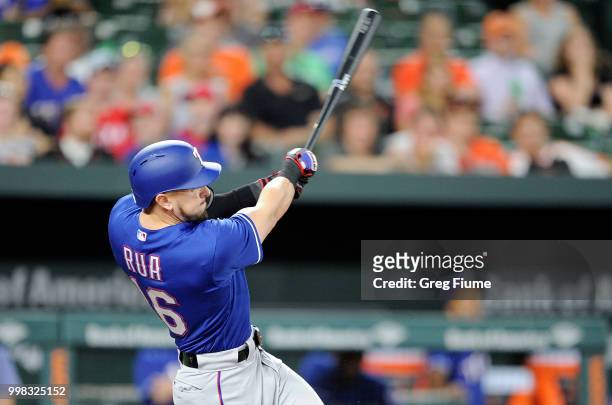 Ryan Rua of the Texas Rangers hits a three-run home run in the seventh inning against the Baltimore Orioles at Oriole Park at Camden Yards on July...