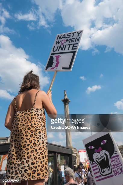 Woman holds a sign saying Nasty women unite during the demonstration against US President Donald Trumps visit to the UK on the second day of the...