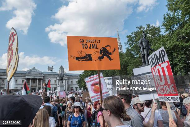 Protester is seen holding a poster during the demonstration against US President Donald Trumps visit to the UK on the second day of the president's...