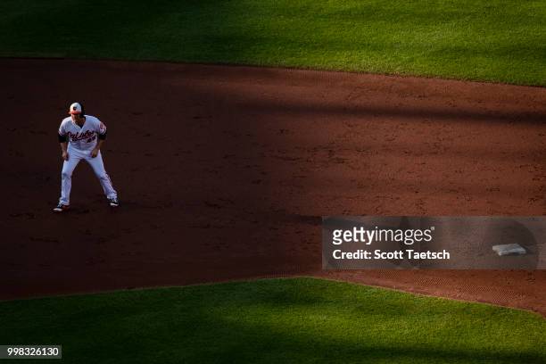 Mark Trumbo of the Baltimore Orioles leads off second base against the Philadelphia Phillies during the second inning at Oriole Park at Camden Yards...