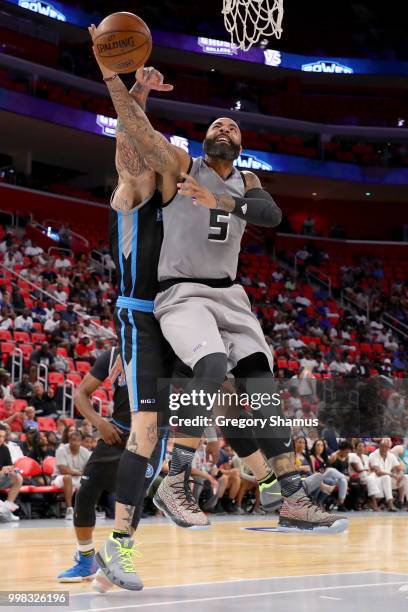 Carlos Boozer of the Ghost Ballers attempts a shot while being guarded by Chris Andersen of Power during BIG3 - Week Four at Little Caesars Arena on...