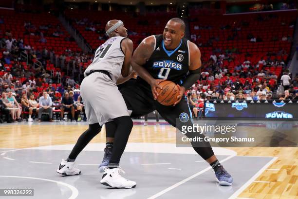 Glen Davis of Power dribbles the ball while being guarded by Ricky Davis of the Ghost Ballers during BIG3 - Week Four at Little Caesars Arena on July...