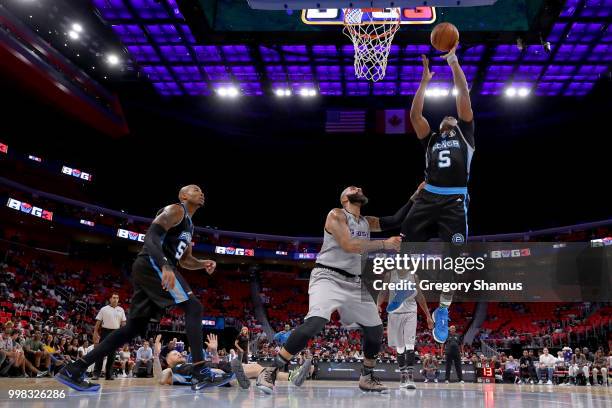 Cuttino Mobley of Power attempts a shot while being guarded by Carlos Boozer of the Ghost Ballers during BIG3 - Week Four at Little Caesars Arena on...