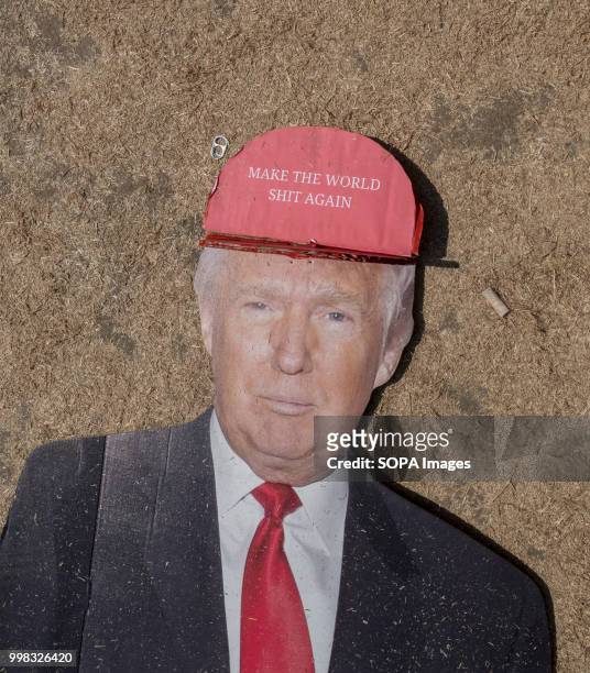 Cardboard cut out of Donald Trump is discarded during the demonstration. Protest against US President Donald Trumps visit to the UK on the second day...