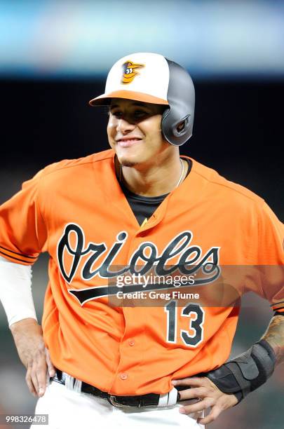 Manny Machado of the Baltimore Orioles stands on first base in the eighth inning against the Texas Rangers at Oriole Park at Camden Yards on July 13,...