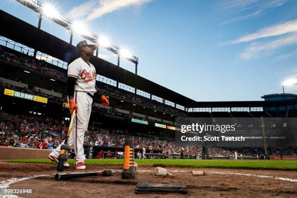 Tim Beckham of the Baltimore Orioles warms up in the batters circle against the Philadelphia Phillies during the seventh inning at Oriole Park at...