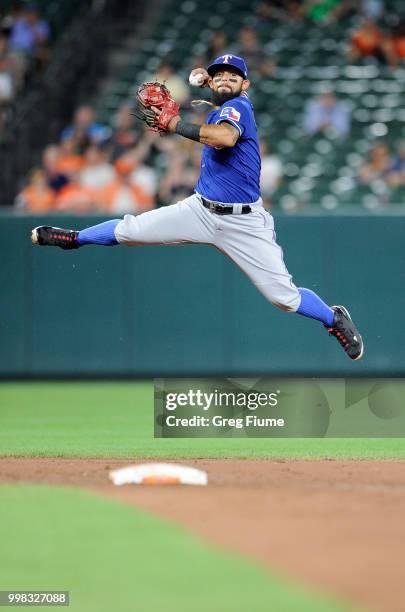 Rougned Odor of the Texas Rangers throws out Jonathan Schoop of the Baltimore Orioles in the sixth inning at Oriole Park at Camden Yards on July 13,...