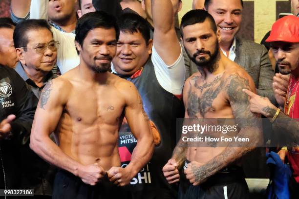 Manny Pacquiao of the Philippines and Lucas Matthysse of Argentina pose during weigh-in for their fight July 14, 2018 in Kuala Lumpur, Malaysia.