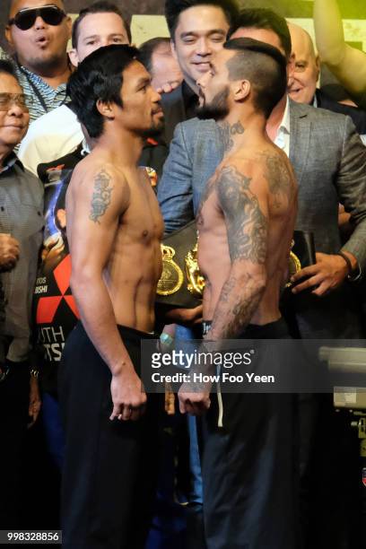 Manny Pacquiao of the Philippines and Lucas Matthysse of Argentina pose during weigh-in for their fight July 14, 2018 in Kuala Lumpur, Malaysia.
