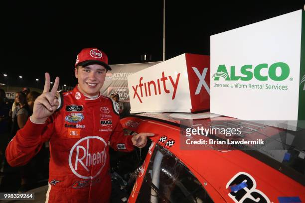 Christopher Bell, driver of the Rheem Toyota, poses in Victory Lane with the winner's decal after winning the NASCAR Xfinity Series Alsco 300 at...