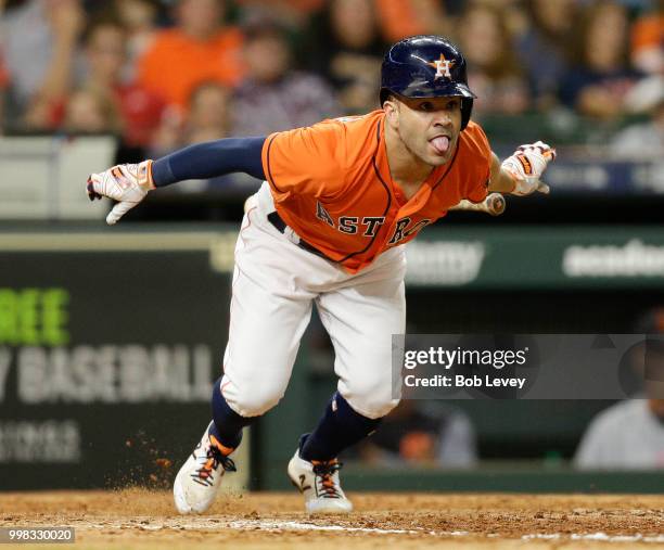 Jose Altuve of the Houston Astros singles in the eighth inning against the Detroit Tigers at Minute Maid Park on July 13, 2018 in Houston, Texas.