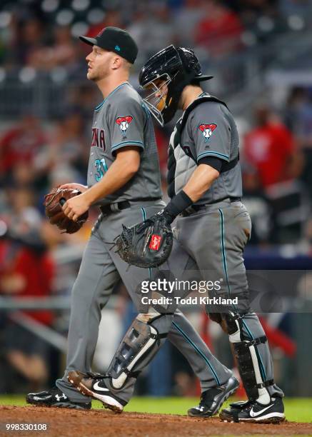 Brad Boxberger of the Arizona Diamondbacks and Alex Avila of the Arizona Diamondbacks celebrate the victory at the conclusion of an MLB game against...