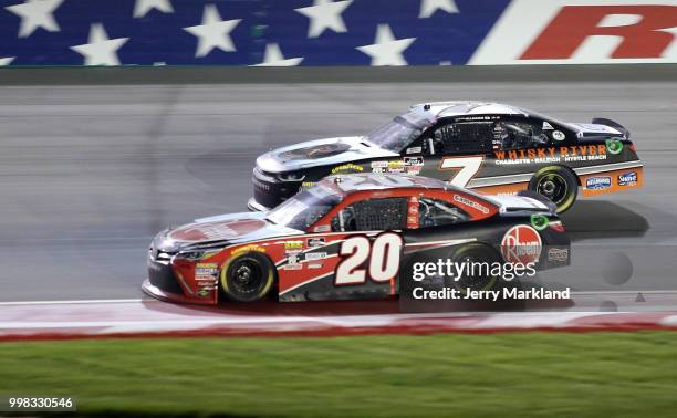 Christopher Bell, driver of the Rheem Toyota, races Justin Allgaier, driver of the Dale Jr's Whisky River Chevrolet, during the NASCAR Xfinity Series...