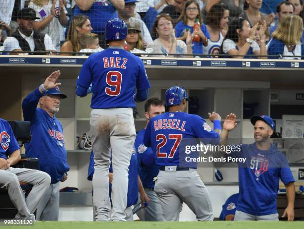 Addison Russell of the Chicago Cub and Javier Baez are congratulated after scoring during the second inning of a baseball game against the San Diego...