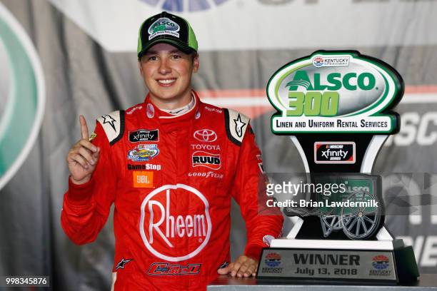 Christopher Bell, driver of the Rheem Toyota, poses in Victory Lane after winning the NASCAR Xfinity Series Alsco 300 at Kentucky Speedway on July...