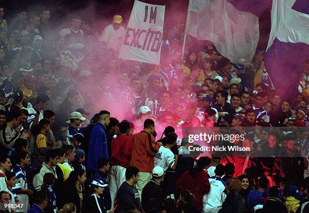 Fans light up a flare in the stadium during the NRL third qualifying final match played between the Bulldogs and the St George Illawarra Dragons held...