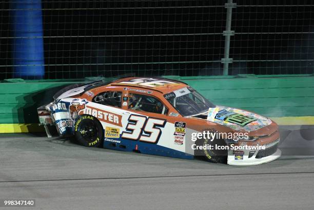 Joey Gase Archie St Hilaire Chevrolet Camaro ZL1 backs into the turn three wall during the NASCAR Xfinity Series Alsco 300 on July 13th at Kentucky...