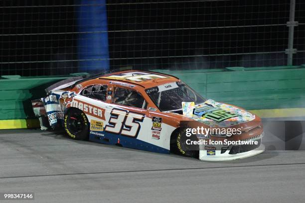 Joey Gase Archie St Hilaire Chevrolet Camaro ZL1 backs into the turn three wall during the NASCAR Xfinity Series Alsco 300 on July 13th at Kentucky...