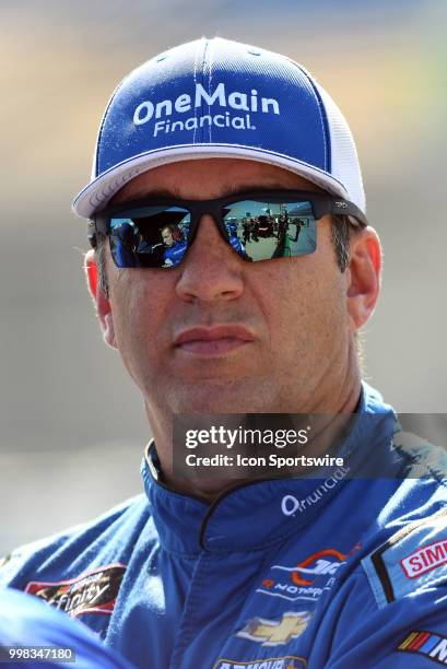 Elliott Sadler JR Motorsports Chevrolet Camaro ZL1 watches a scoring monitor during qualifying for the NASCAR Xfinity Series Alsco 300 on July 13th...