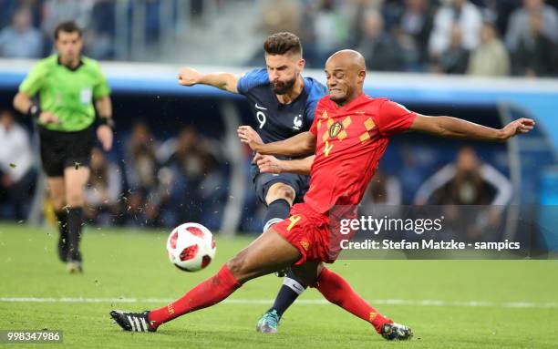 Olivier Giroud of France Vincent Kompany of Belgium during the 2018 FIFA World Cup Russia Semi Final match between Belgium and France at Saint...