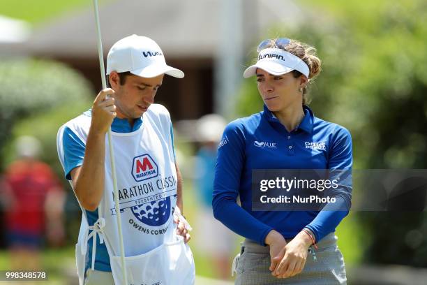 Gaby Lopez of Mexico talks to her caddie on the 8th green during the second round of the Marathon LPGA Classic golf tournament at Highland Meadows...