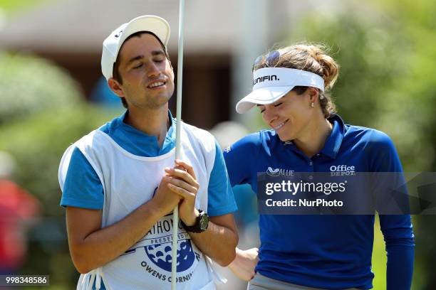 Gaby Lopez of Mexico talks to her caddie on the 8th green during the second round of the Marathon LPGA Classic golf tournament at Highland Meadows...