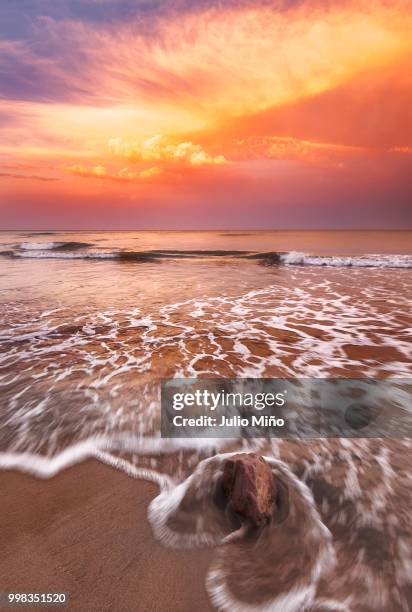 atardecer y roca - sunset and stone - atardecer playa stock pictures, royalty-free photos & images