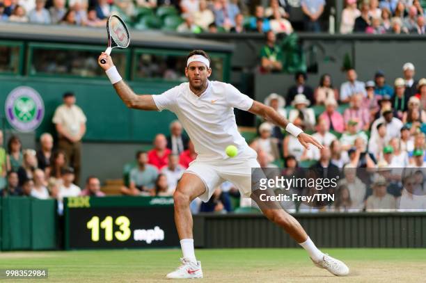 Juan Martin Del Potro of Argentina in action against Rafael Nadal of Spain during the gentlemen's quarter finals at the All England Lawn Tennis and...