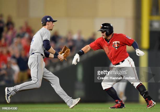 Matt Duffy of the Tampa Bay Rays catches Robbie Grossman of the Minnesota Twins off second base after an RBI double during the sixth inning of the...