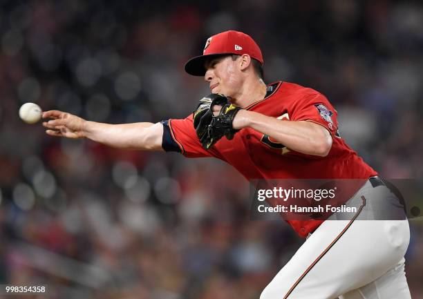 Trevor Hildenberger of the Minnesota Twins delivers a pitch against the Tampa Bay Rays during the eighth inning of the game on July 13, 2018 at...