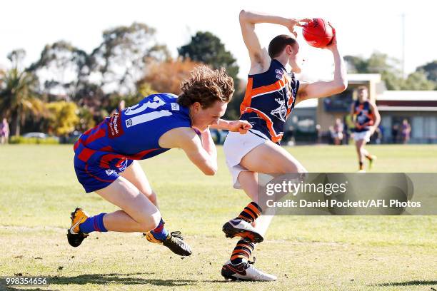 Joshua Kemp of the Cannons and Will Golds of the Chargers contest the ball during the round 12 TAC Cup match between Oakleigh and Calder at Warrawee...