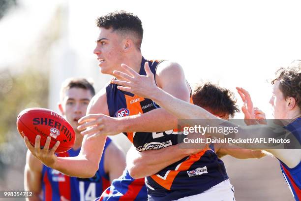 Jake Riccardi of the Cannons and Noah Answerth of the Chargers contest the ball during the round 12 TAC Cup match between Oakleigh and Calder at...