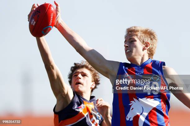 Nick Bryan of the Chargers and Harrison Jones of the Cannons contest the ball during the round 12 TAC Cup match between Oakleigh and Calder at...