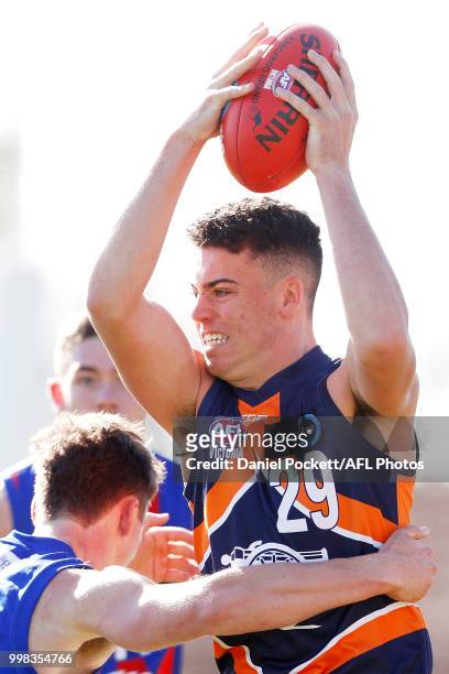 Jake Riccardi of the Cannons and Noah Answerth of the Chargers contest the ball during the round 12 TAC Cup match between Oakleigh and Calder at...