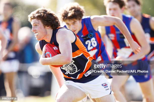 Campbell Barton of the Cannons runs with the ball during the round 12 TAC Cup match between Oakleigh and Calder at Warrawee Park on July 14, 2018 in...