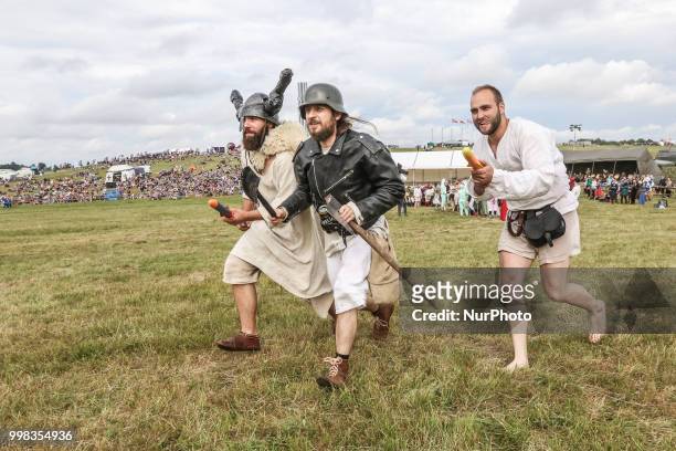 People dressed in a funny way are seen in Grunwald, Poland on 13 July 2018 Battle of Grunwald reenactment participants take part in the last...