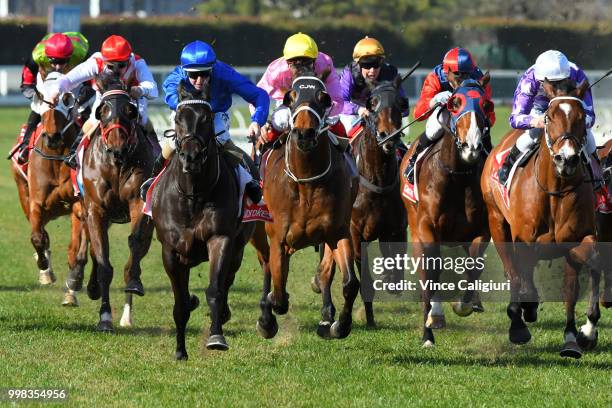 Damian Lane riding Demolition defeats Ben Melham riding The Avenger in Race 4 during Melbourne Racing at Caulfield Racecourse on July 14, 2018 in...