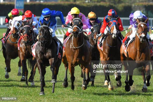 Damian Lane riding Demolition defeats Ben Melham riding The Avenger in Race 4 during Melbourne Racing at Caulfield Racecourse on July 14, 2018 in...