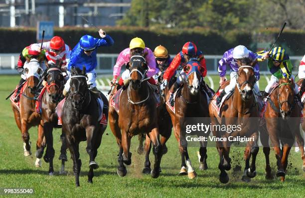 Damian Lane riding Demolition defeats Ben Melham riding The Avenger in Race 4 during Melbourne Racing at Caulfield Racecourse on July 14, 2018 in...