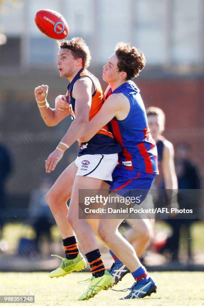 Tye Browning of the Cannons and Riley Collier-Dawkins of the Chargers contest the ball during the round 12 TAC Cup match between Oakleigh and Calder...